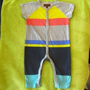 Multi-colored short sleeve onesie, seven jeans, size 3-6 months.